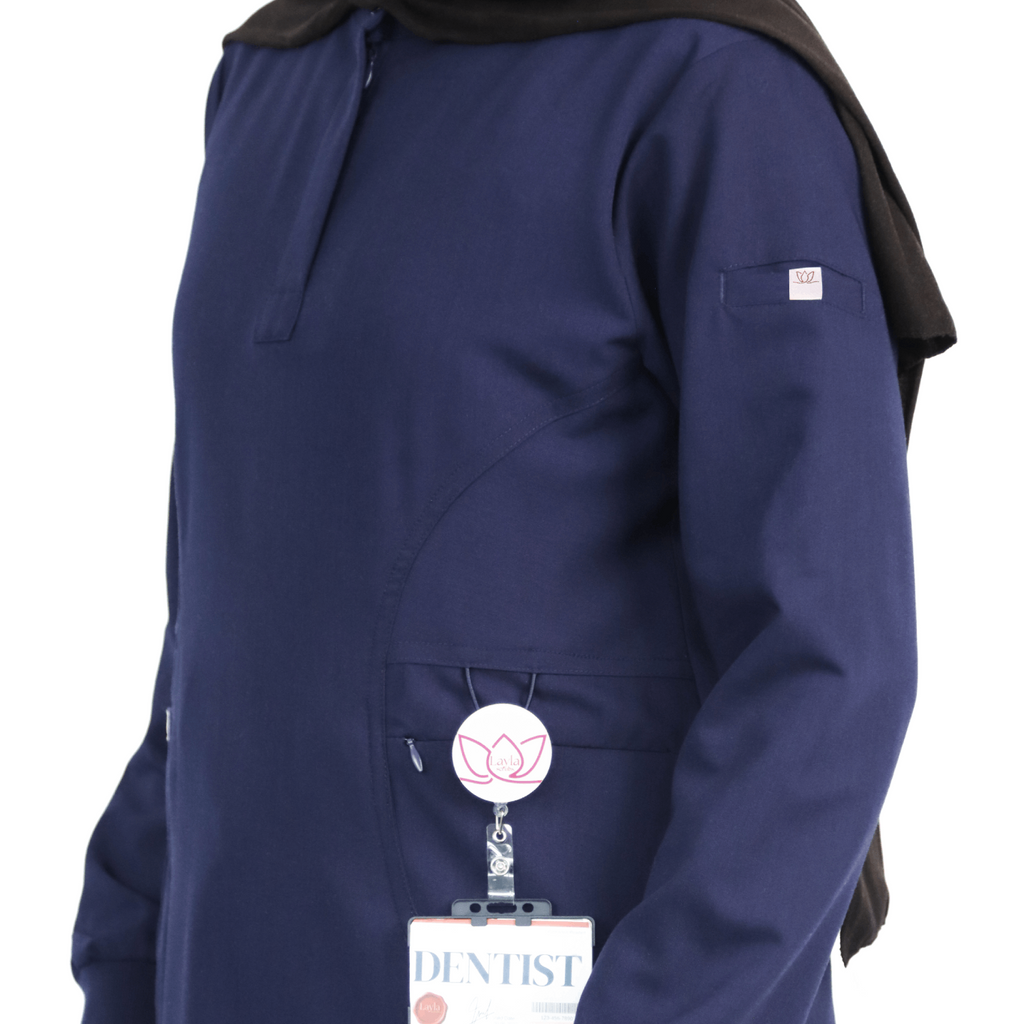 Stretchy breathable fabric used in navy modest medical scrubs for women.