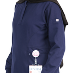 Stretchy breathable fabric used in navy modest medical scrubs for women.
