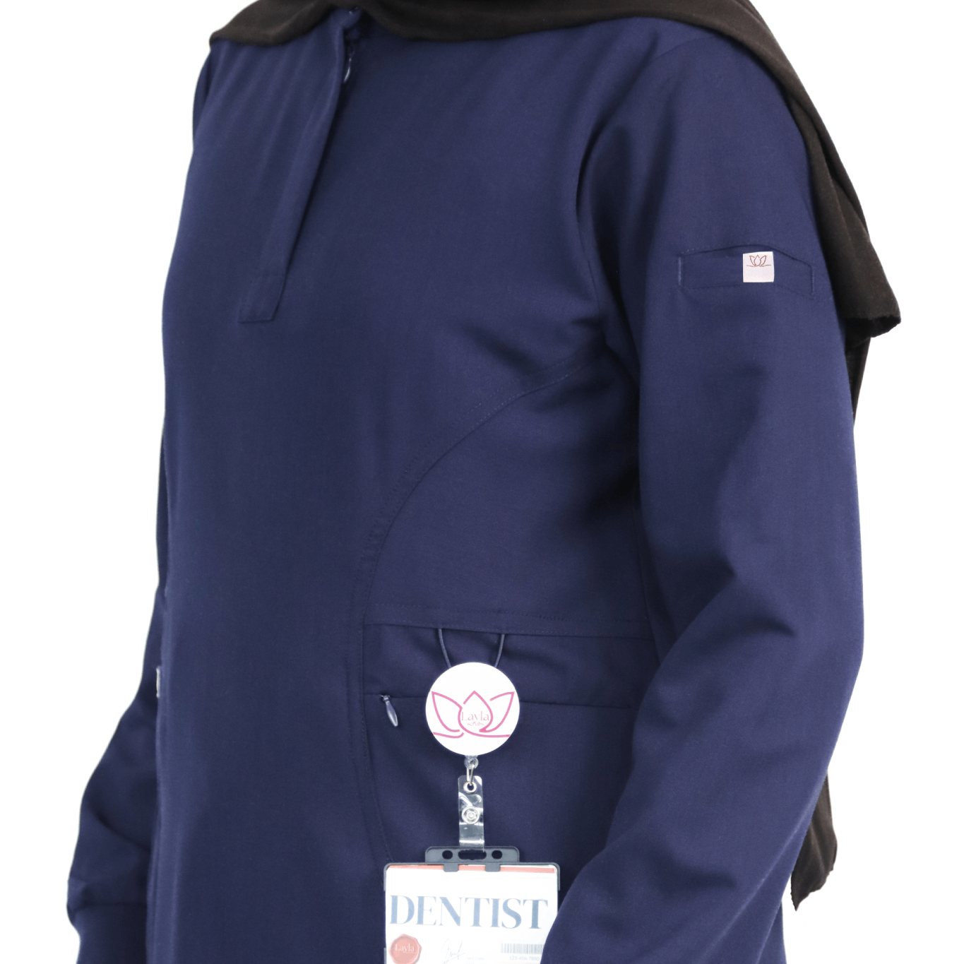 Stretchy breathable fabric used in navy modest medical scrubs for women.