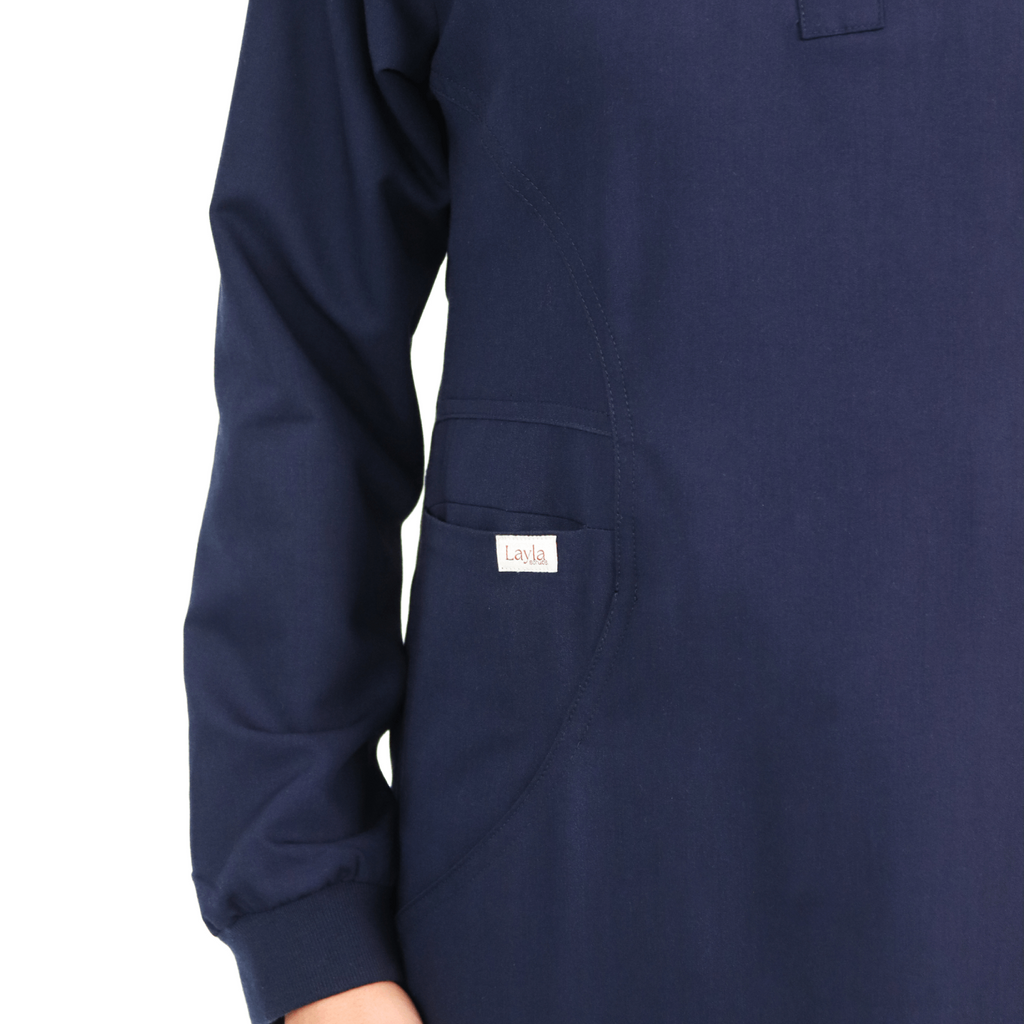 Navy modest-fit medical scrubs  uniform offering long coverage for Muslim and hijabi healthcare professionals.